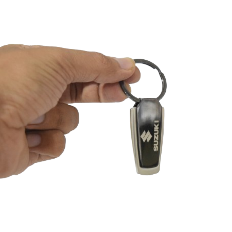 Suzuki genuine key chain with a metallic rectangle design featuring the Suzuki logo.